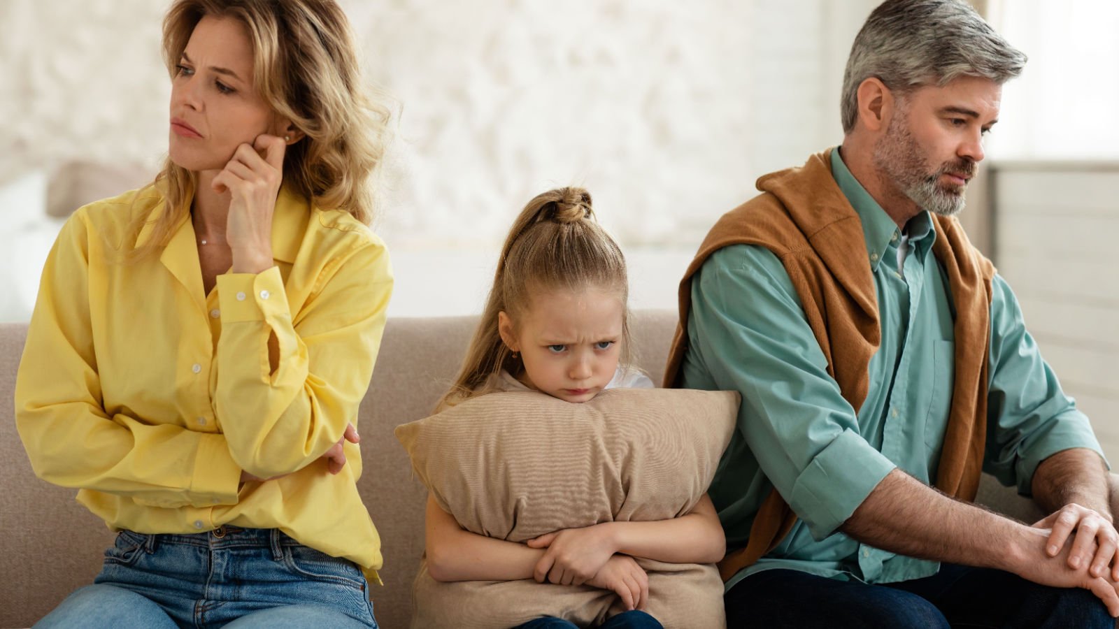 Unhappy Family Of Three Sitting Together Having Problems In Relationship daughter prostock studio shutterstock