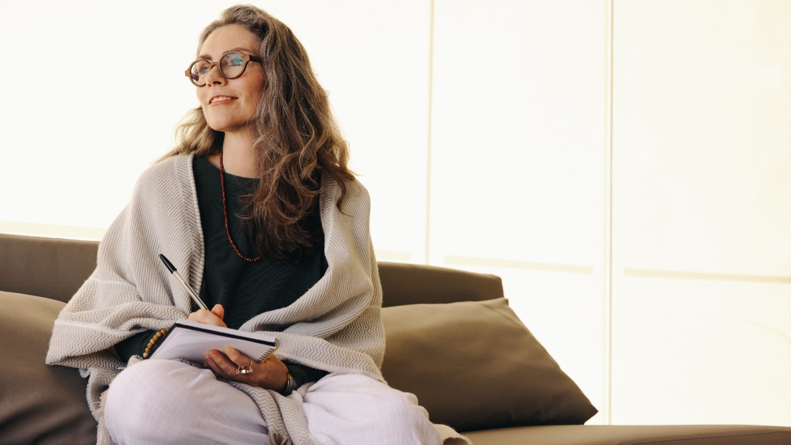 Woman Journaling self care reflection introspection therapy Jacob Lund Shutterstock