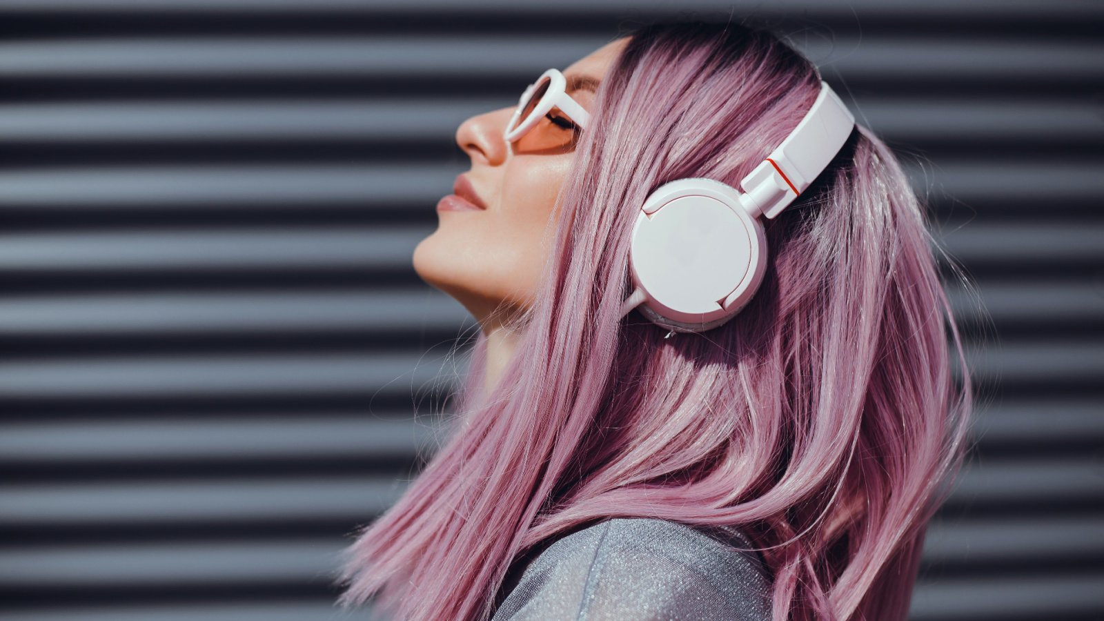 Woman Listening Music Headphones Pink Hair sergey causelove shutterstock