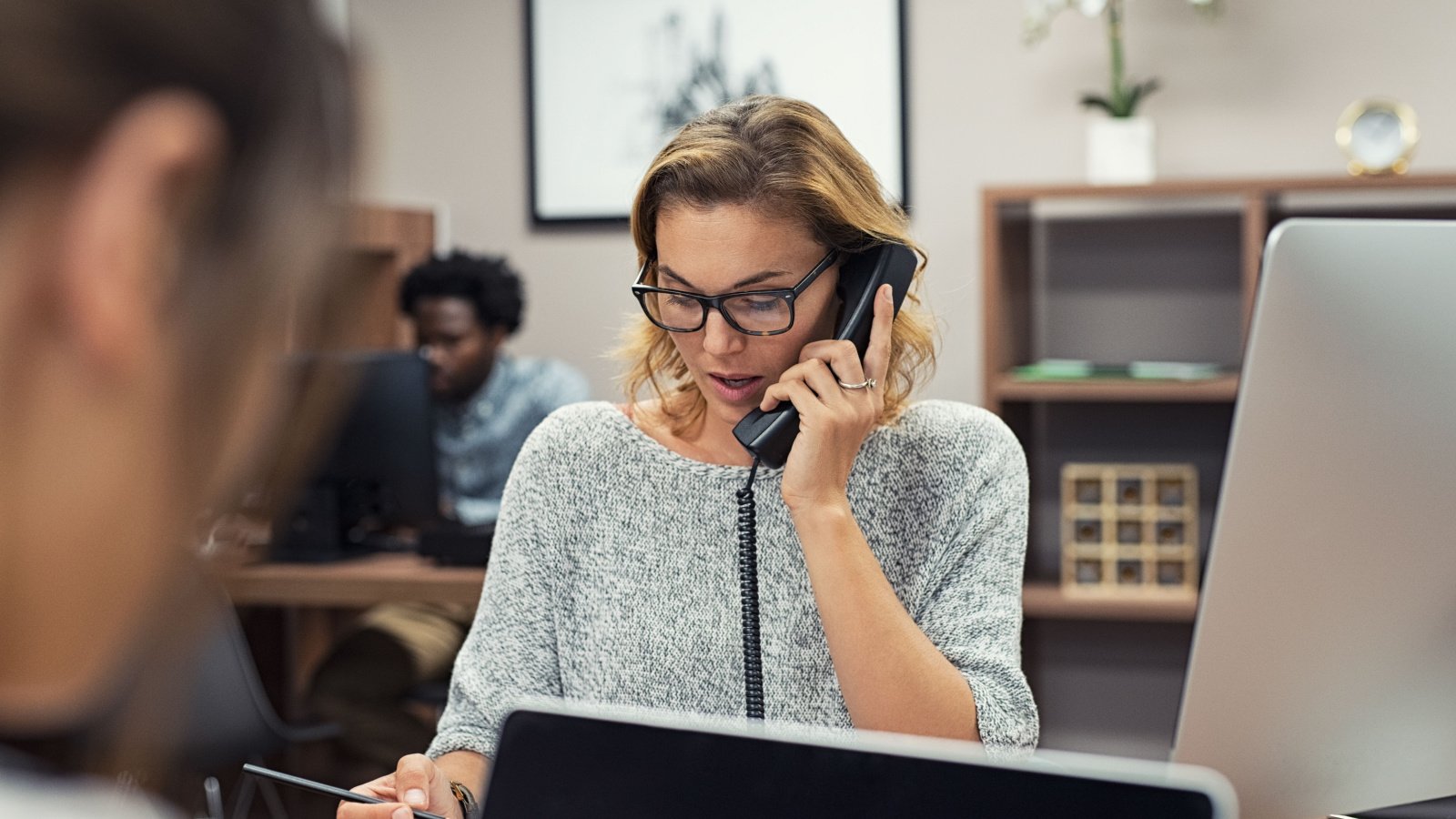 Woman Mature Phone receptionist assistant business boss Ground Picture Shutterstock