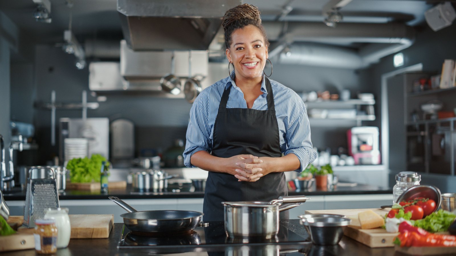 Woman POC Chef Cooking Healthy Job Gorodenkoff Shutterstock