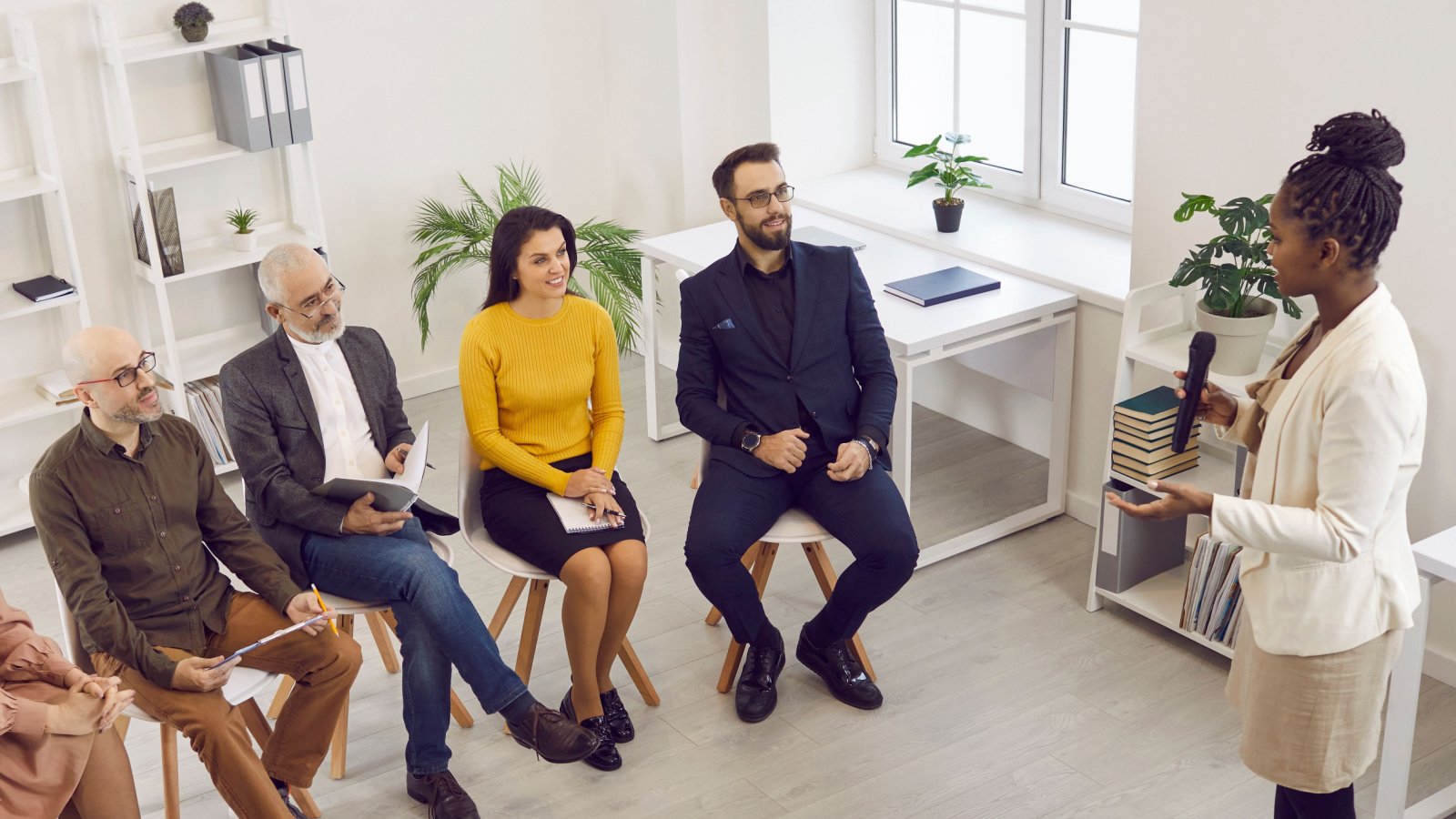 Woman POC Public Speaking Small group Studio Romantic Shutterstock