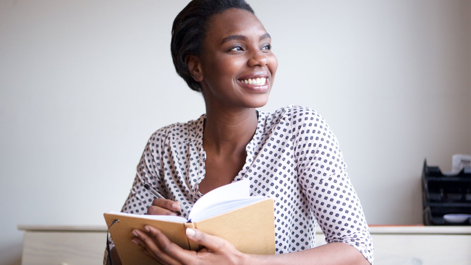 Woman POC journaling planning self care reflection introspection mimagephotography Shutterstock