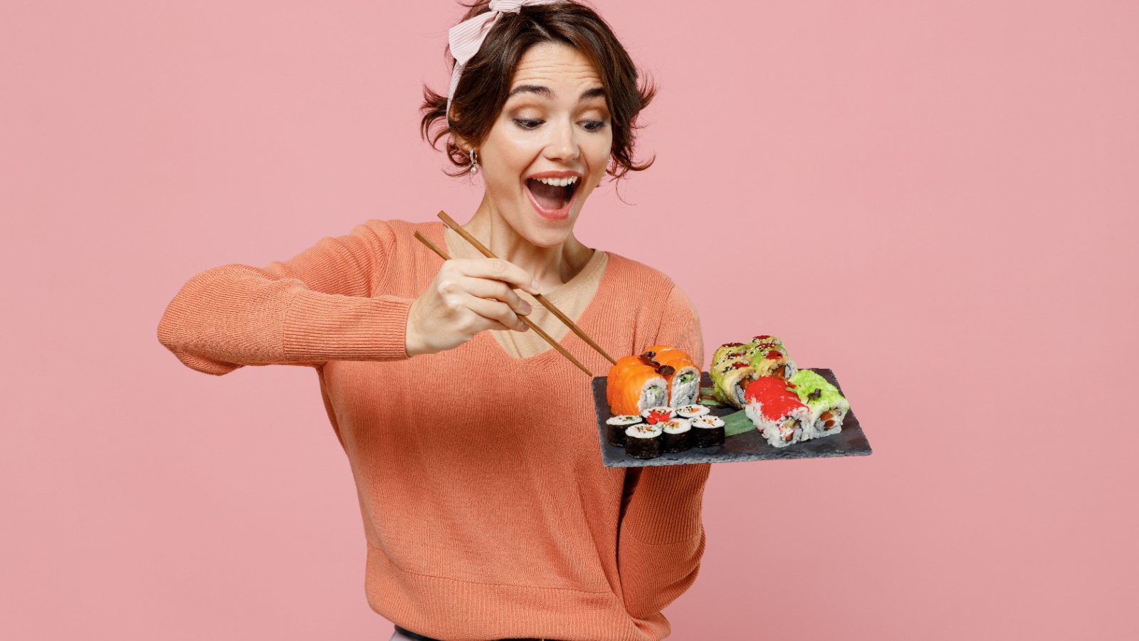 Woman Sushi Food Eating ViDI Studio Shutterstock