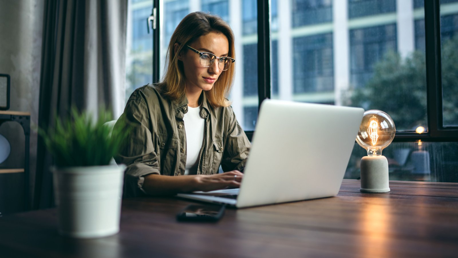 Woman Working Computer writer journalist editor social media job Rymden Shutterstock