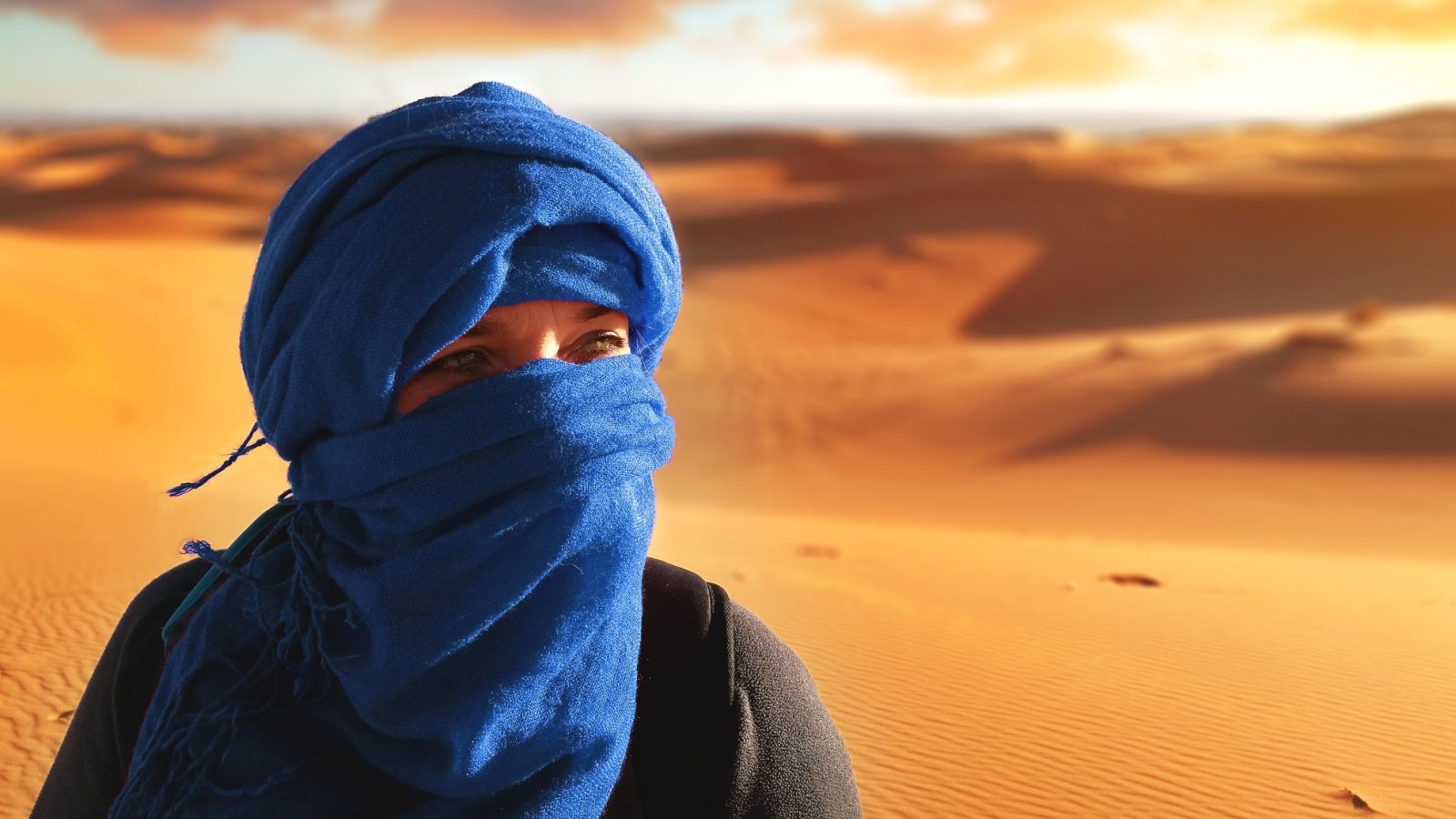 Woman Wrapped In Turban Sahara Desert Morocco nadia acosta Shutterstock