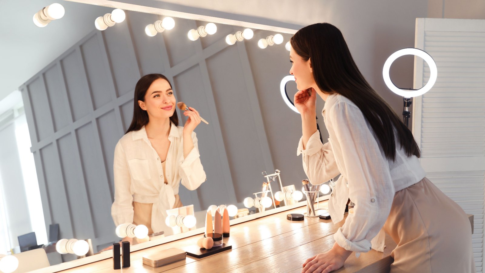 Woman applying makeup beauty style getting ready New Africa Shutterstock