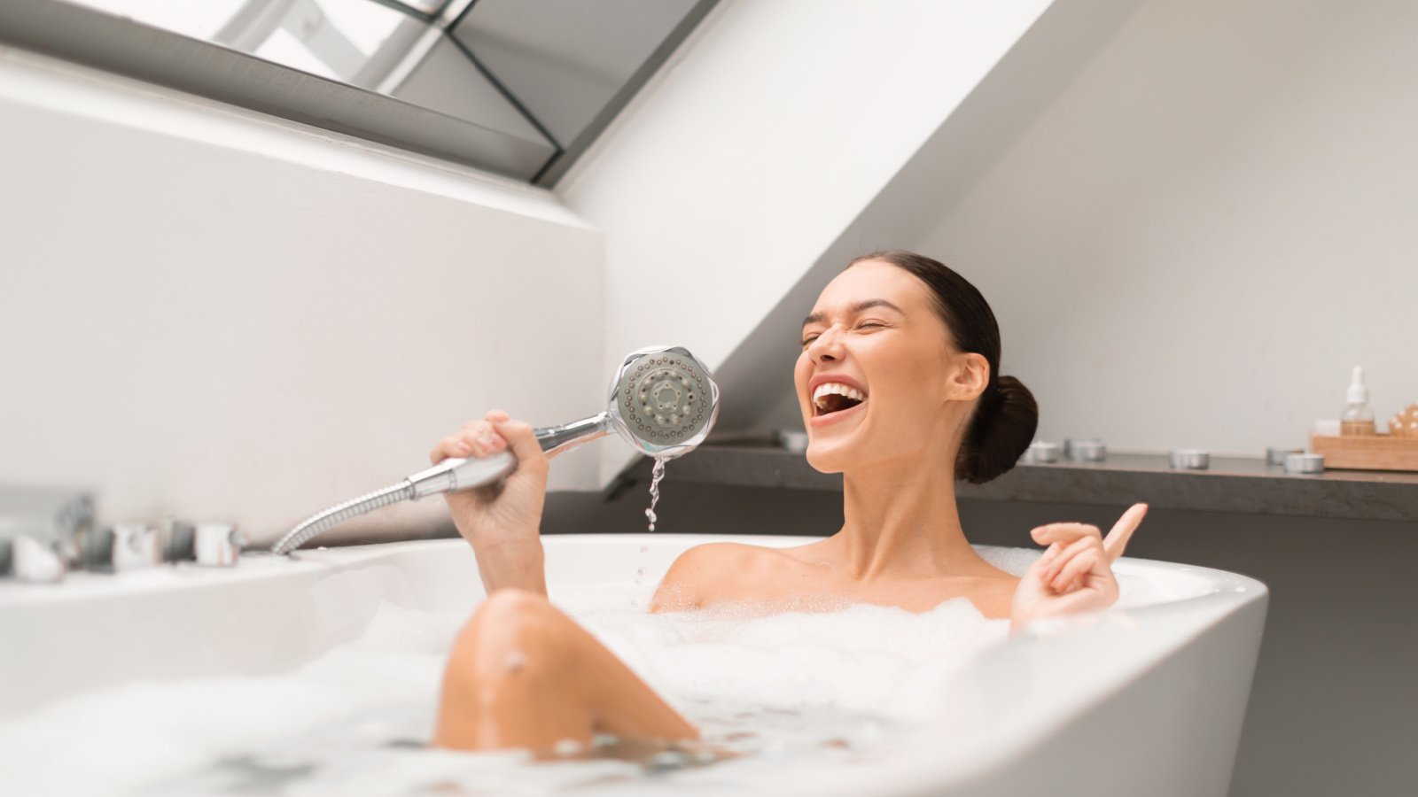 Woman bathing singing clean self care Prostock studio Shutterstock