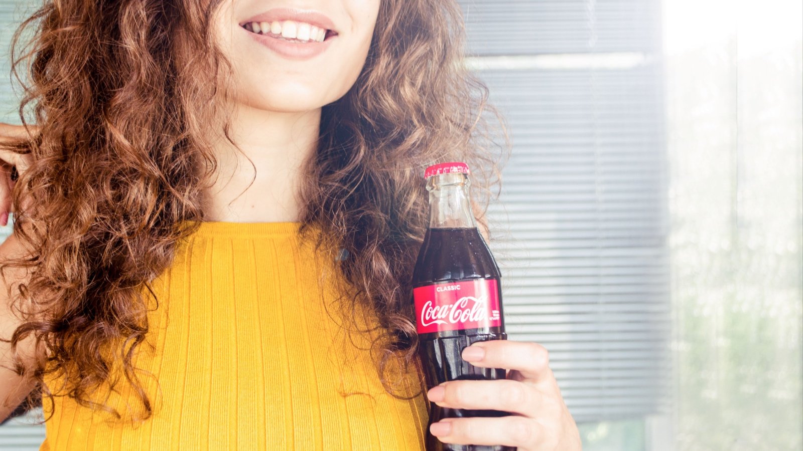 Woman drinking coca cola ECOSY Shutterstock