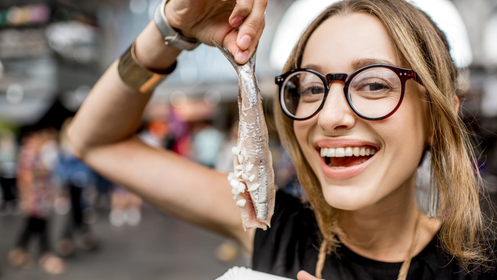 Woman eat culture herring travel fish food RossHelen Shutterstock