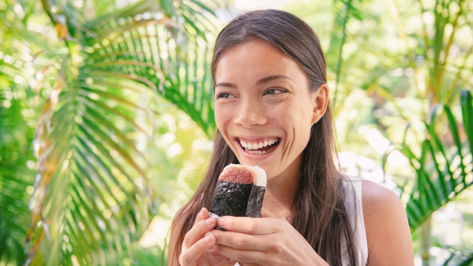 Woman eating Spam Musubi sandwich Maridav Shutterstock Woman eating Spam Musubi sandwich Maridav Shutterstock