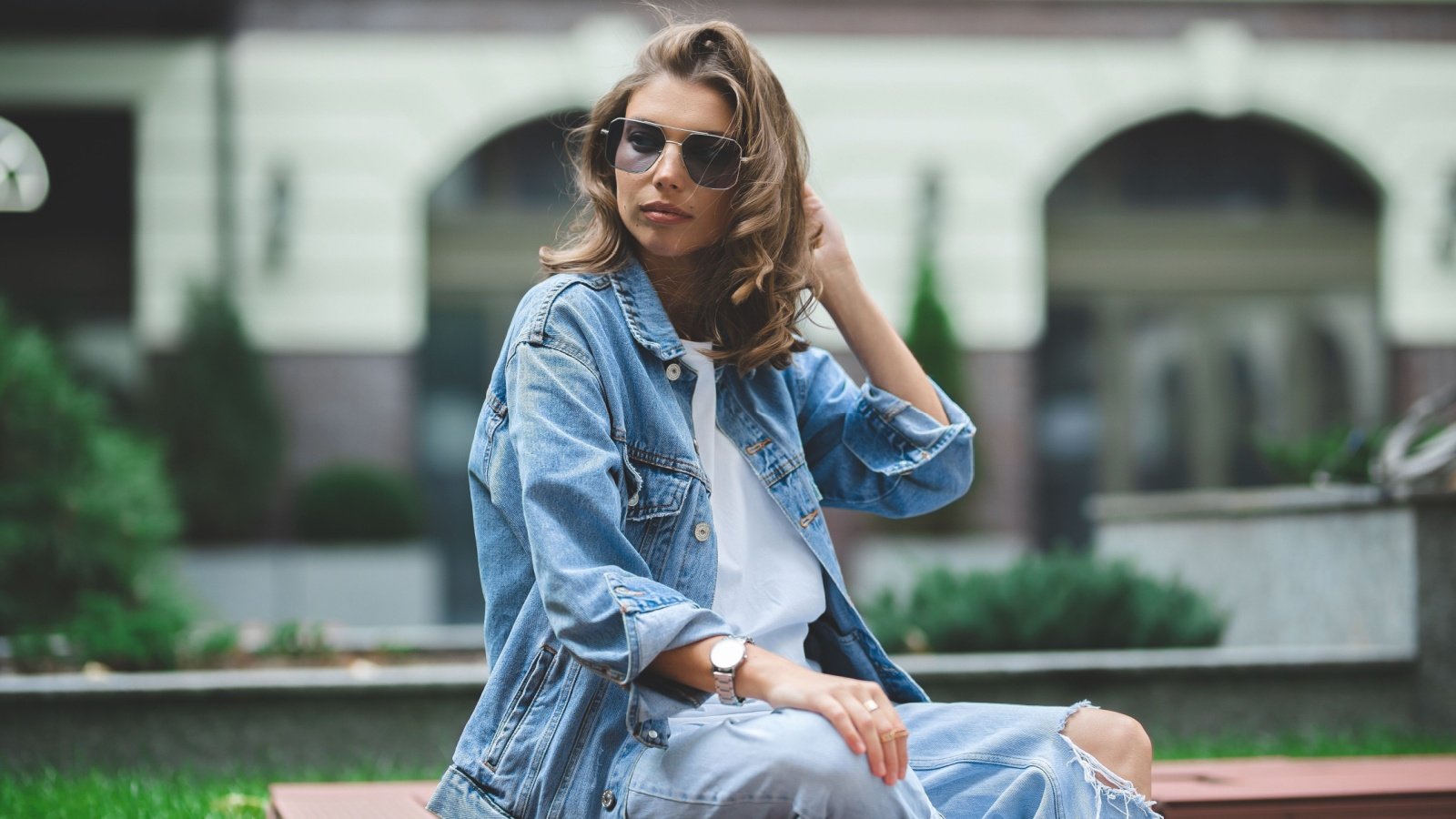 Woman fashion denim jacket sunglasses watch Kravets Misha Shutterstock