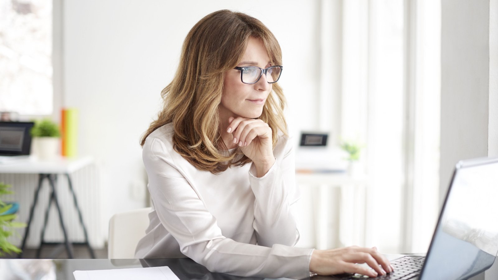 Woman mature business working computer boss Kinga Shutterstock