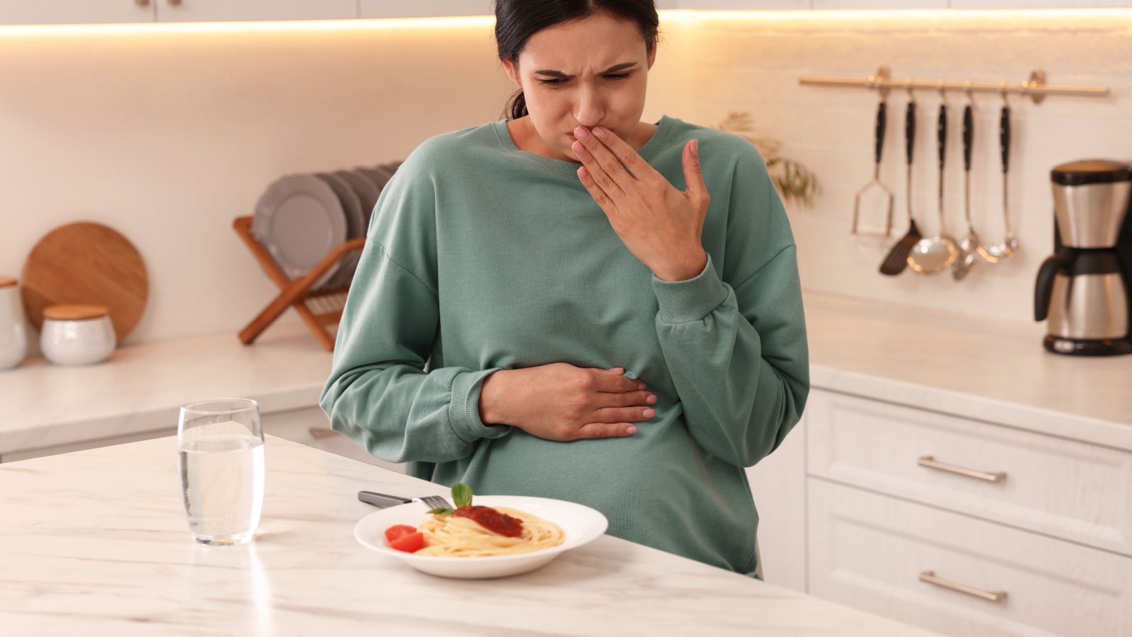 Woman nausea morning sickness pregnant ill New Africa Shutterstock