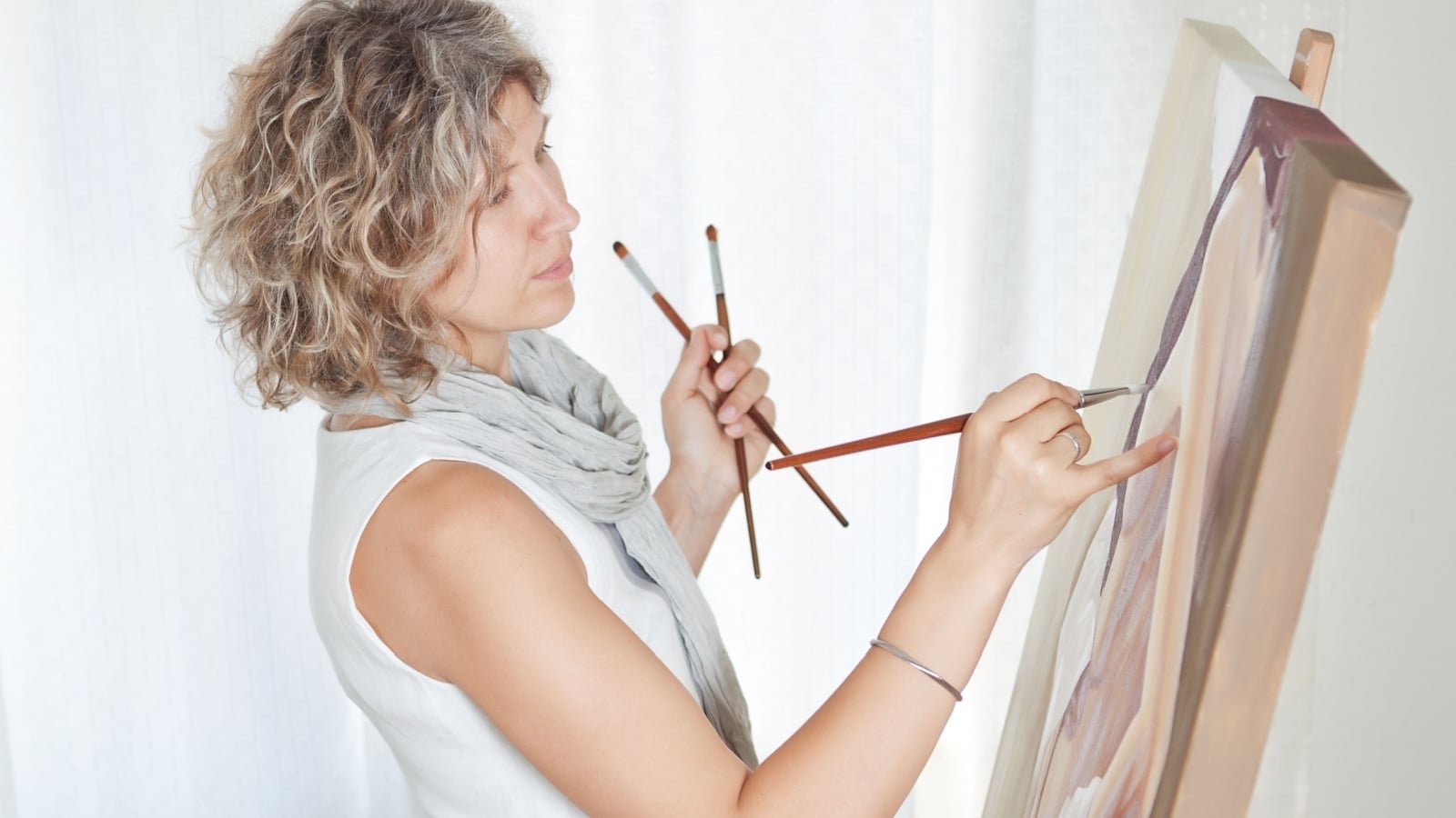 Woman painting artist hobby fun creative wellness Serhiy Stakhnyk Shutterstock