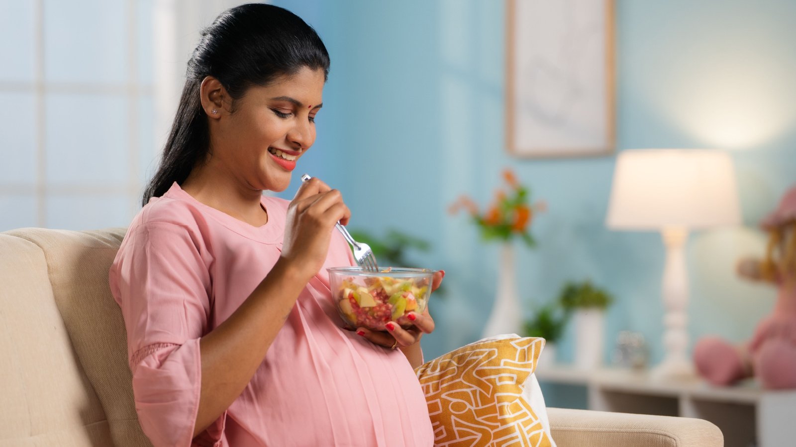 Woman pregnant healthy happy eating WESTOCK PRODUCTIONS Shutterstock