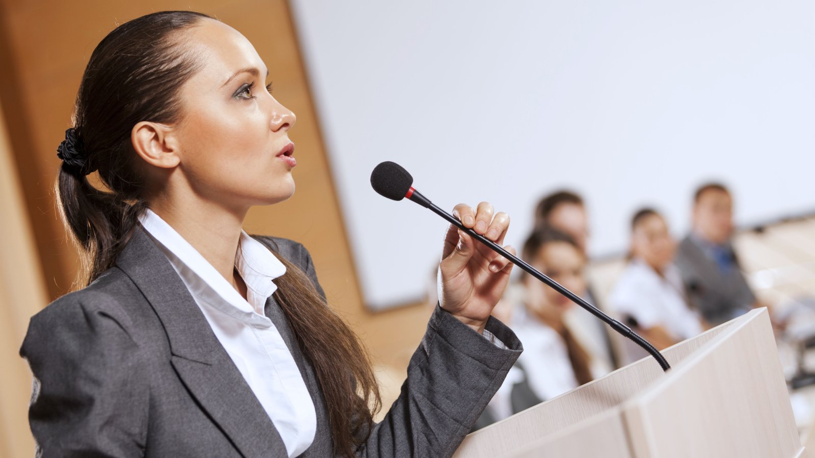 Woman public speaking confident business ESB Professional Shutterstock