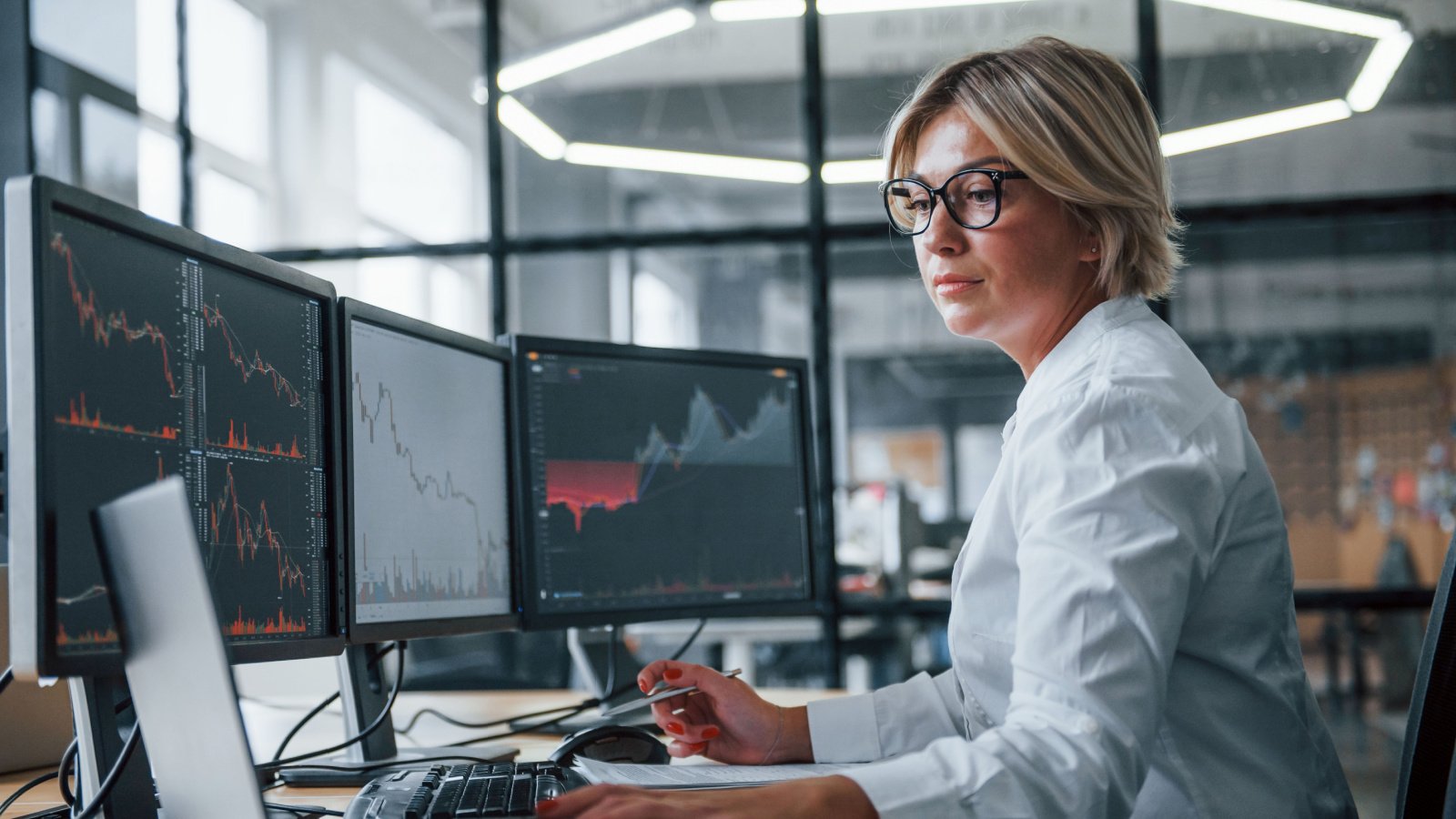 Woman stock broker finance investor work Standret Shutterstock