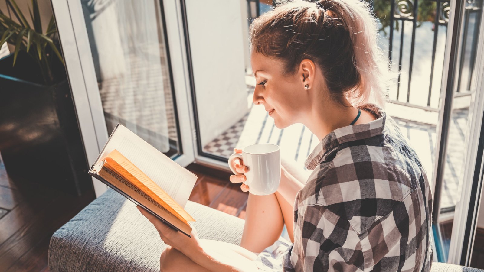 Woman young reading coffee hobby home ASTA Concept Shutterstock