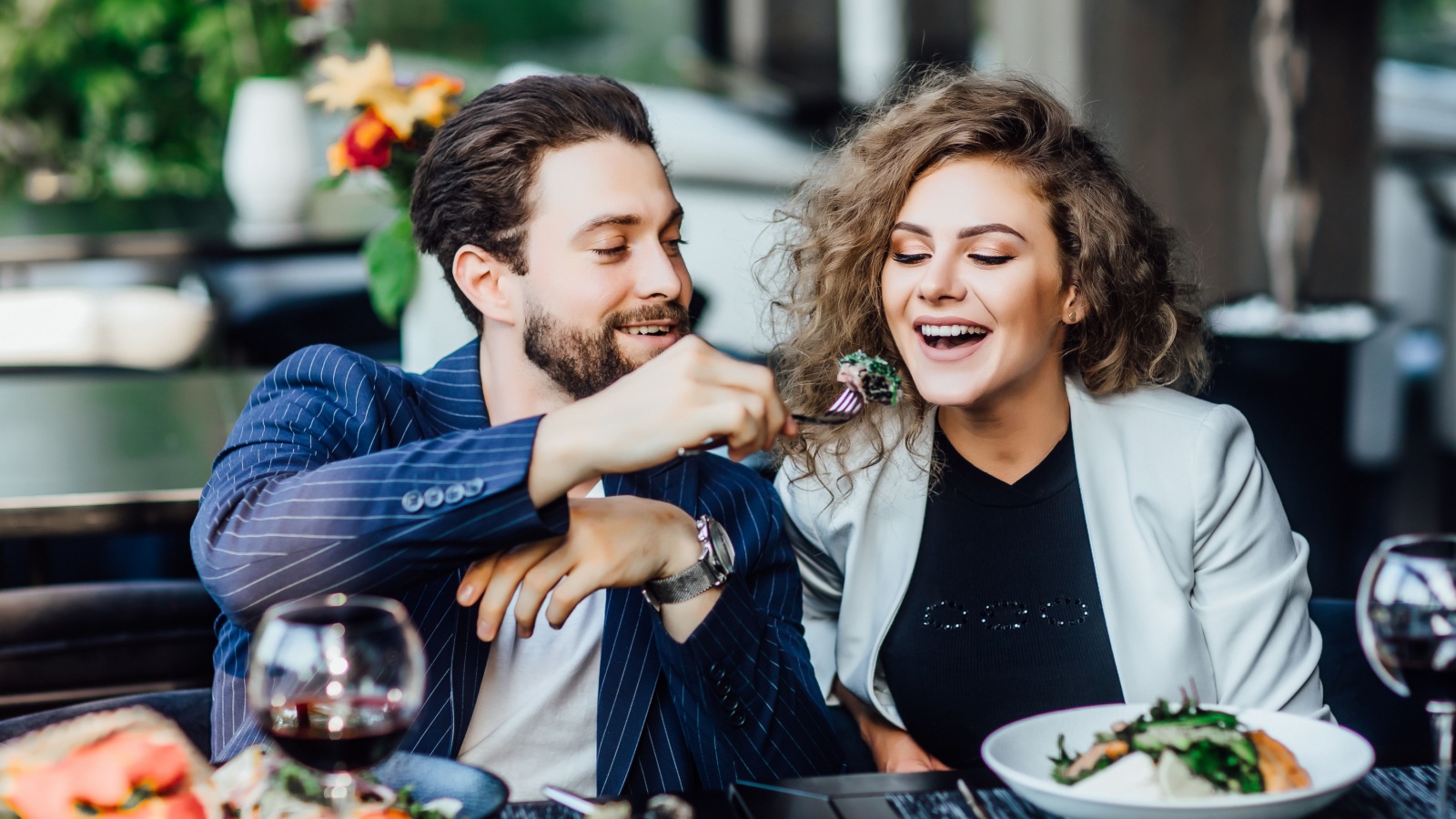 Young couple date restaurant wine steak EZ Stock Studio Shutterstock