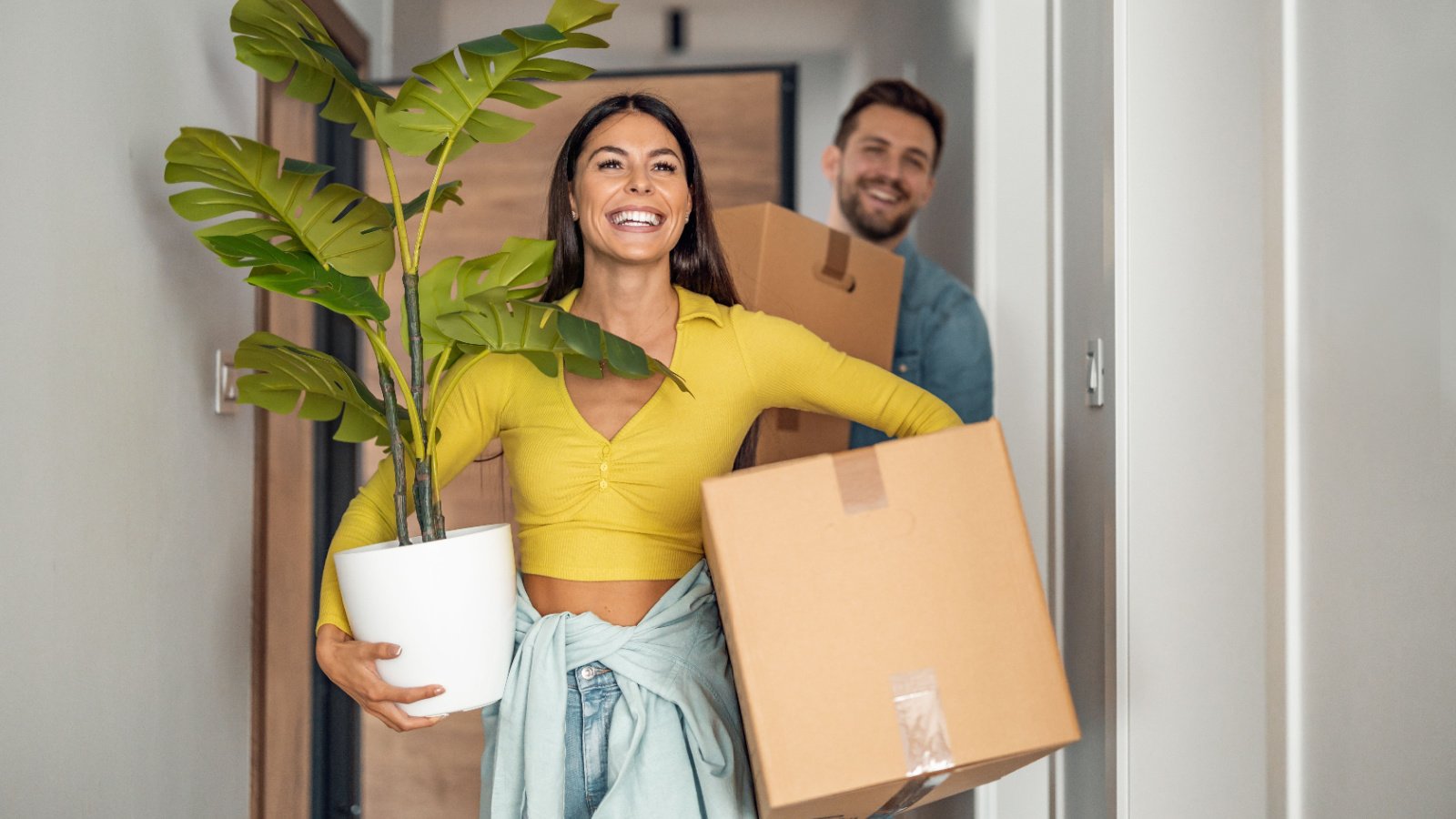 Young couple moving in new home packing house ivanko80 shutterstock