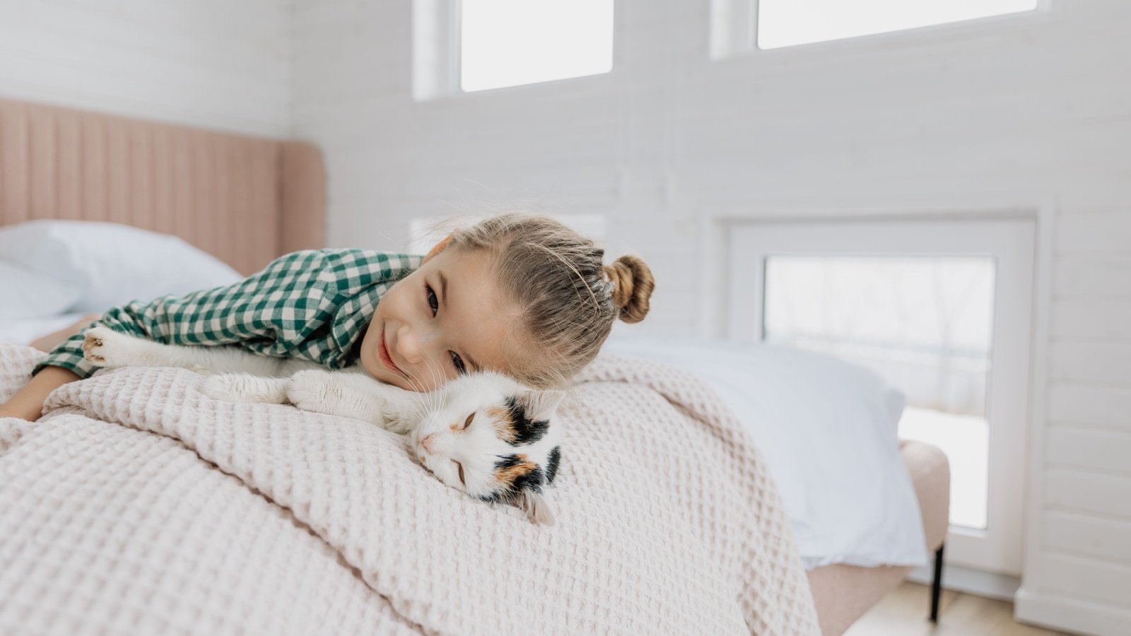 Young girl child kid with her cat Anna Nass Shutterstock