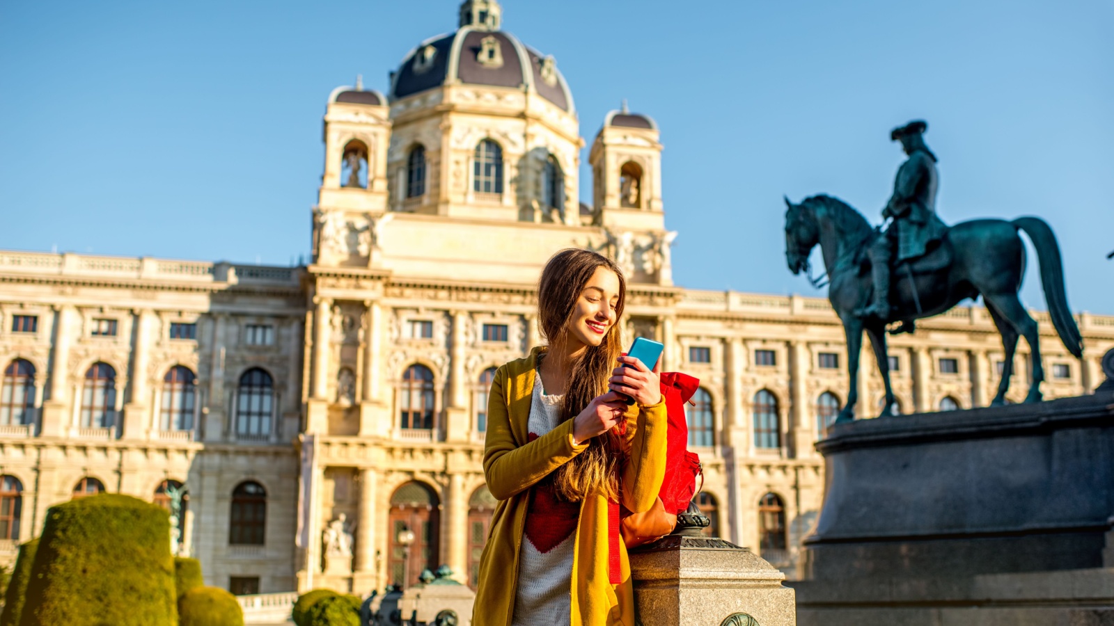 Young woman phone travel Vienna Austria RossHelen Shutterstock