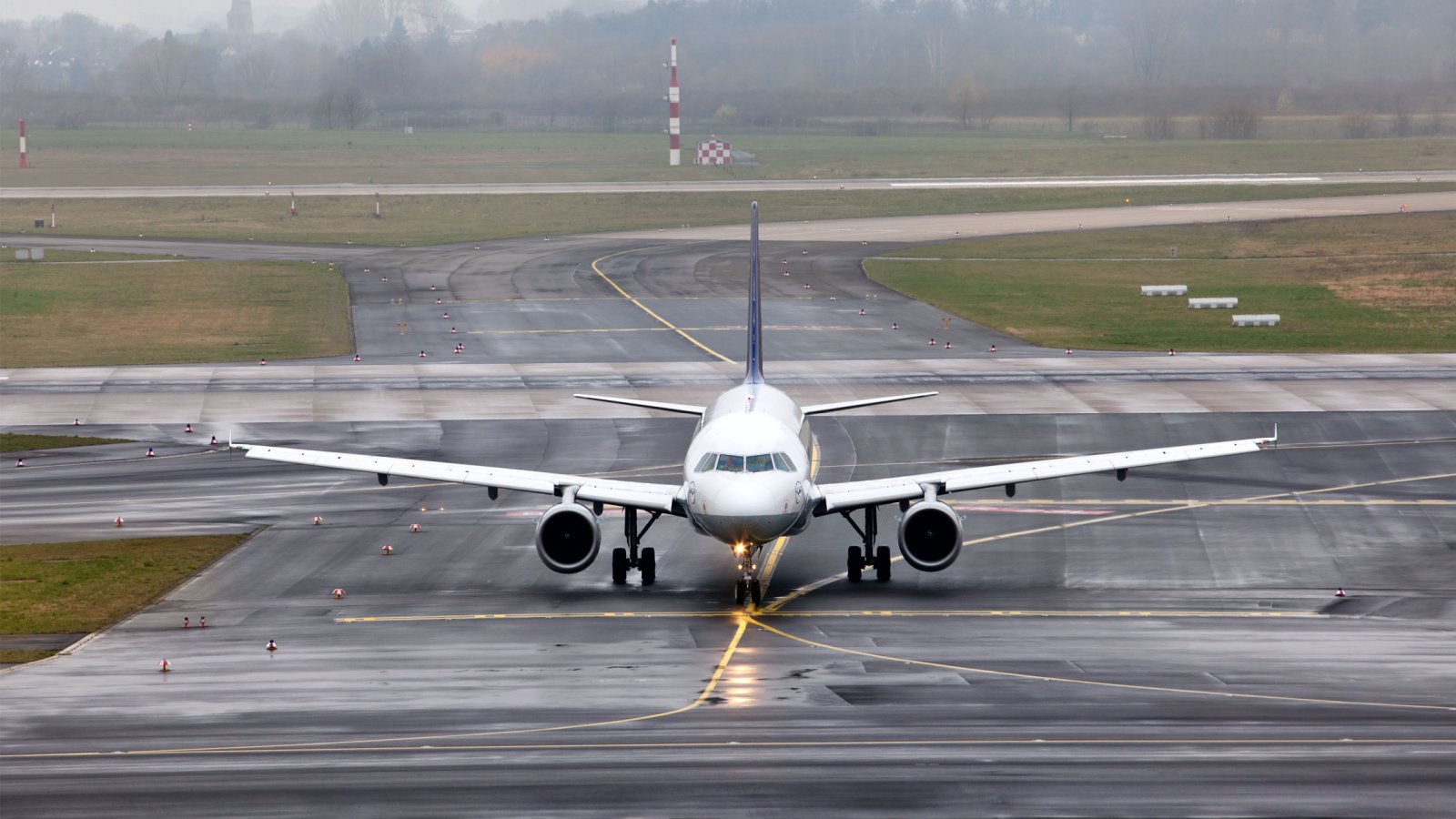 aircraft terminal take off foggy runway airplane NickolayV shutterstock