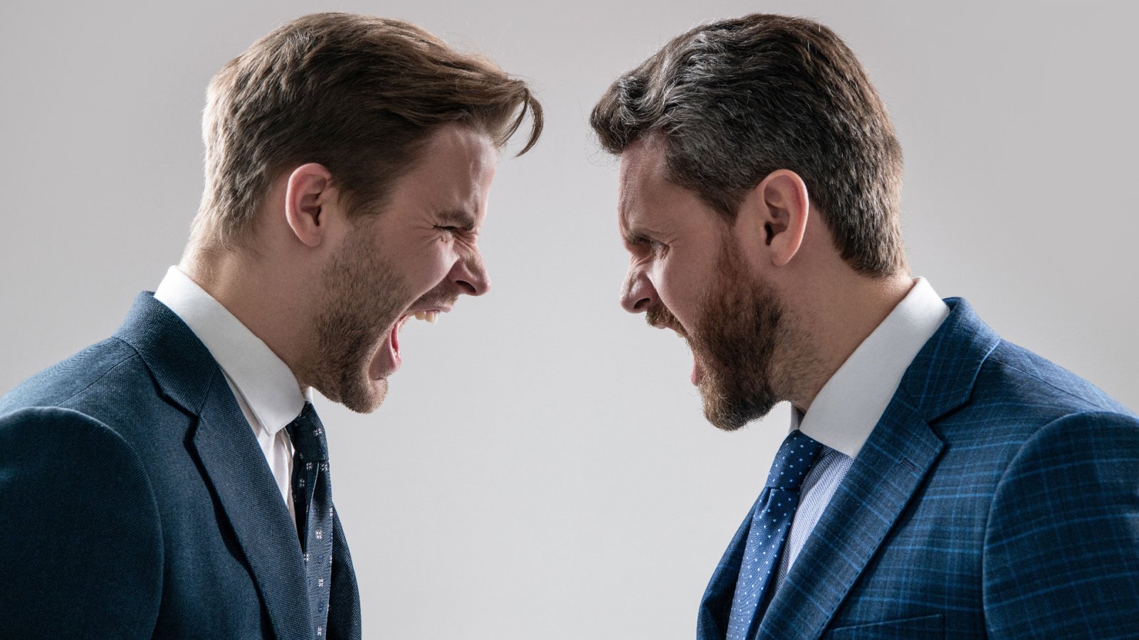 business boss yelling dissatisfied discuss failure colleagues have disagreement conflict suits red fox studio shutterstock