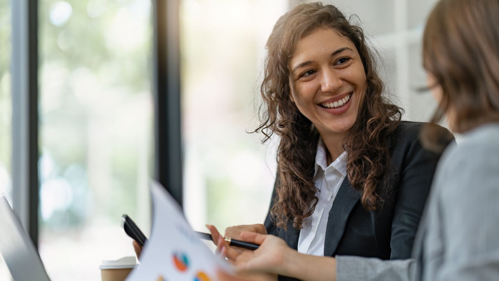 business woman financial advisor report meeting Worawee Meepian shutterstock