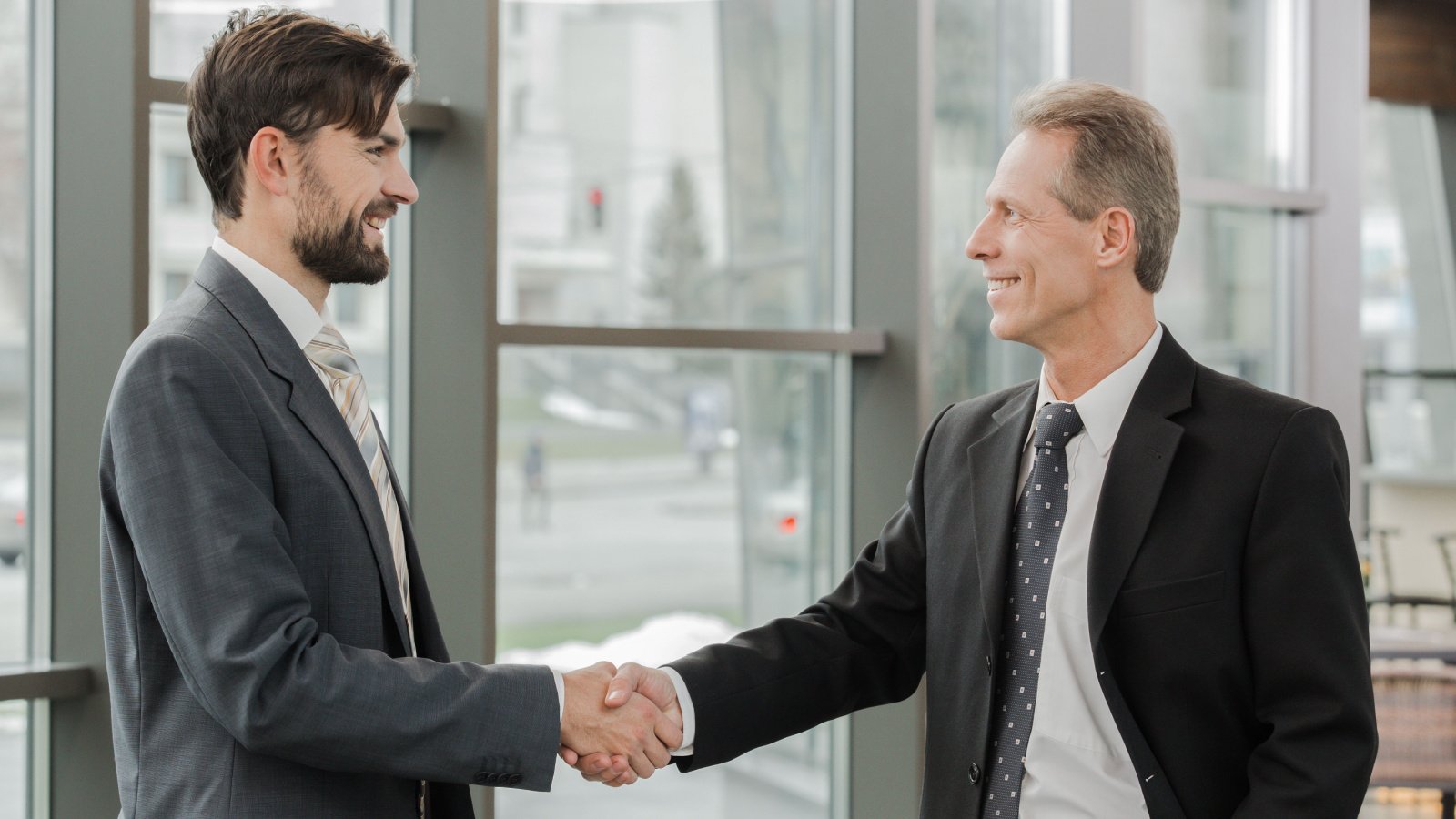 businessmen shaking hands work suits office friends stock shutterstock