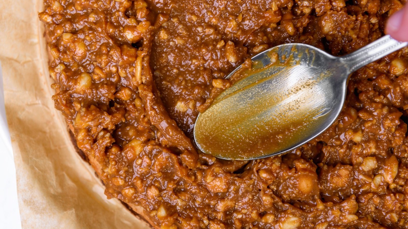 caramel and nuts hickory pie filling spoon Natallia Ploskaya Shutterstock