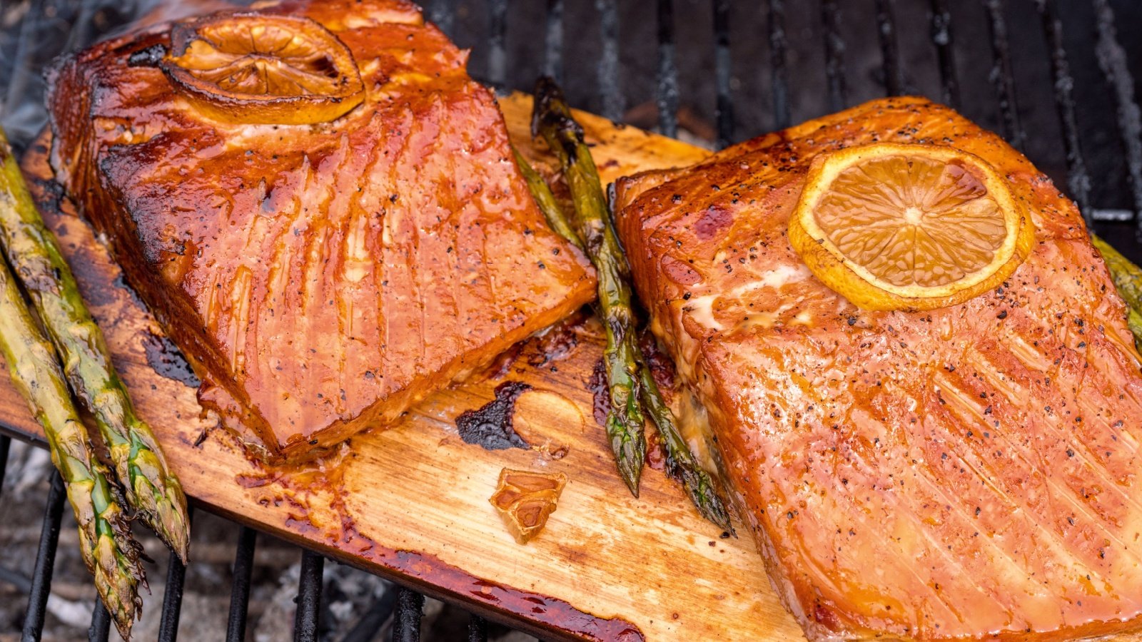 cedar plank salmon with lemon cooking on grill Elena Shashkina Shutterstock