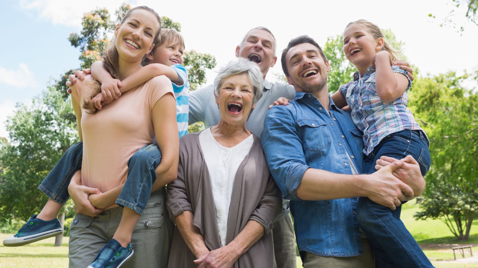 cheerful extended family outside park esb professional shutterstock