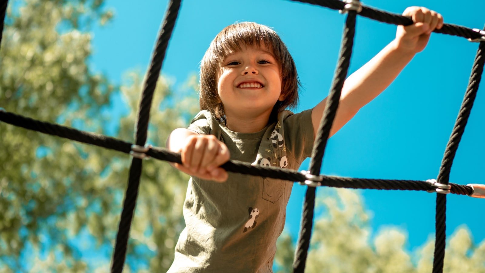 child playing climbing up Nastuffa Shutterstock