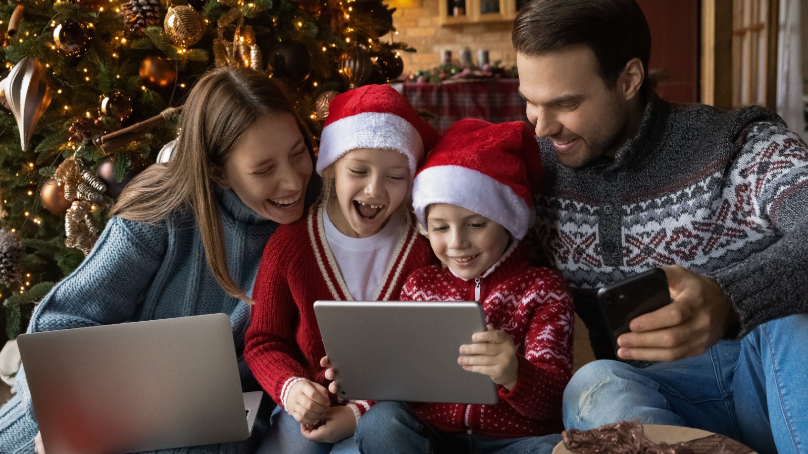 children parenting holiday movie christmas family ipad screen time gifts happy fizkes Shutterstock