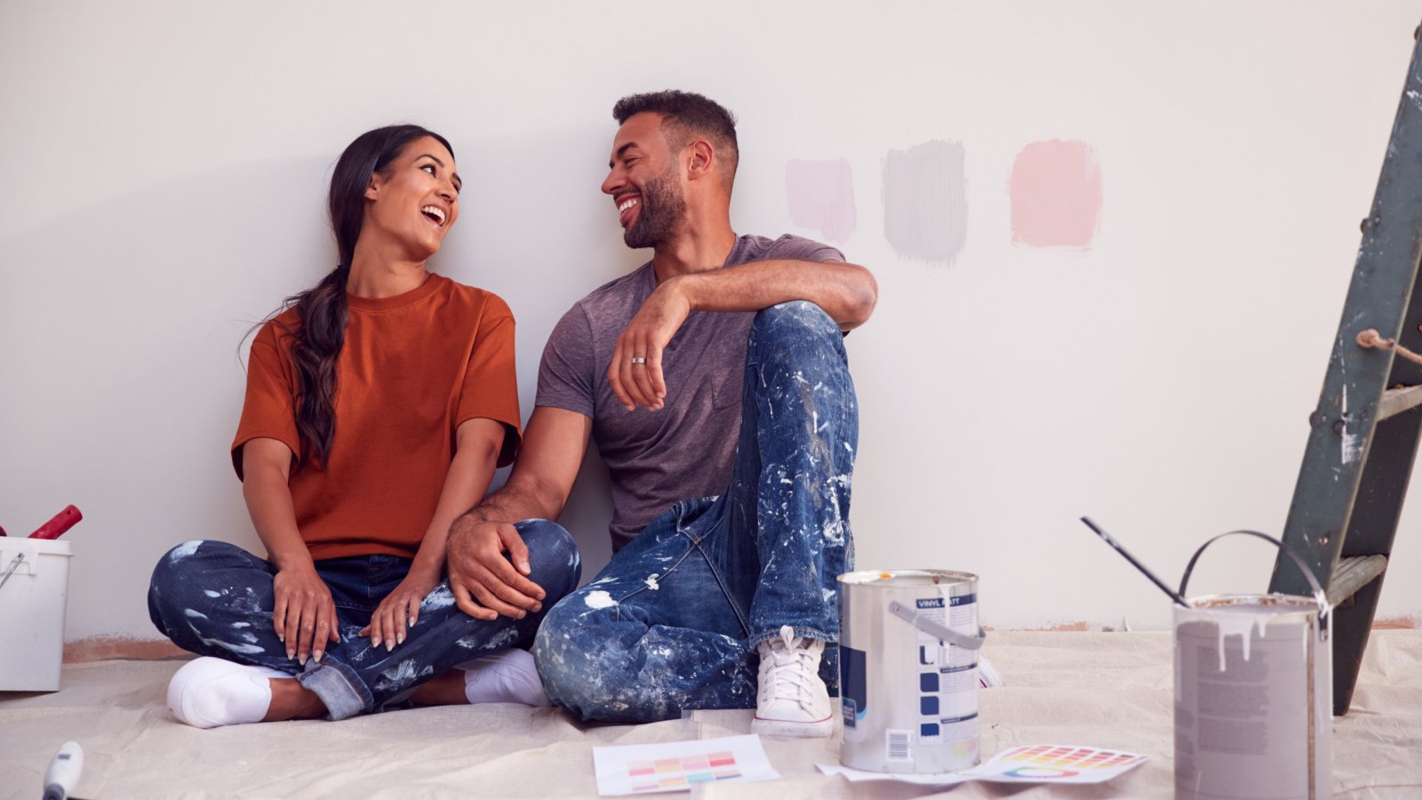 couple painting their home together Monkey Business Images shutterstock