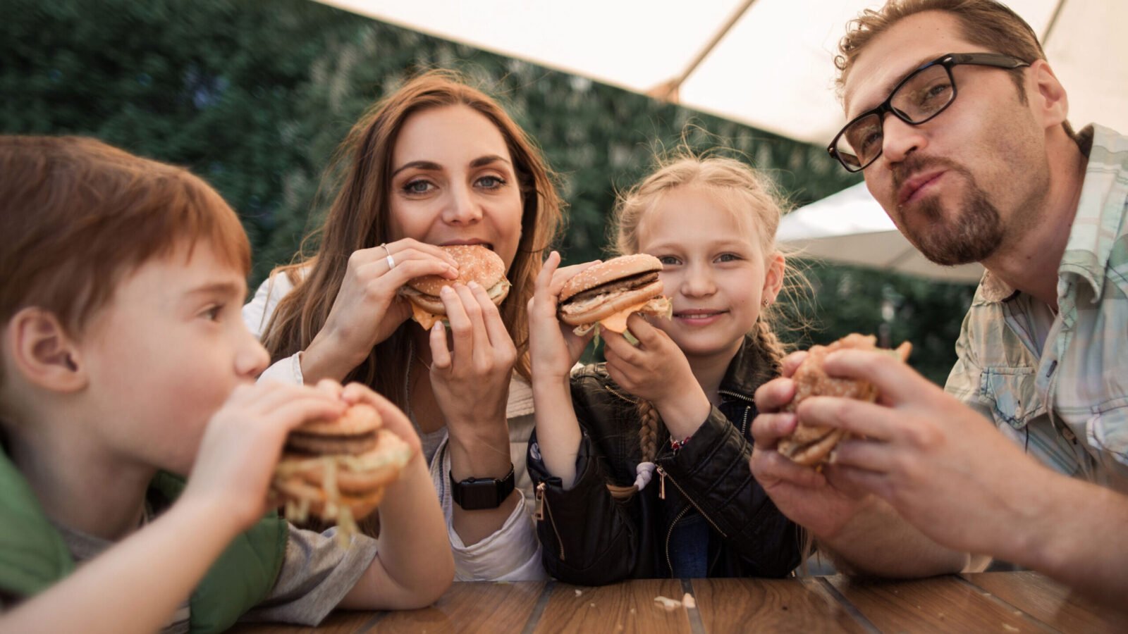 family dinner outside asdf media shutterstock