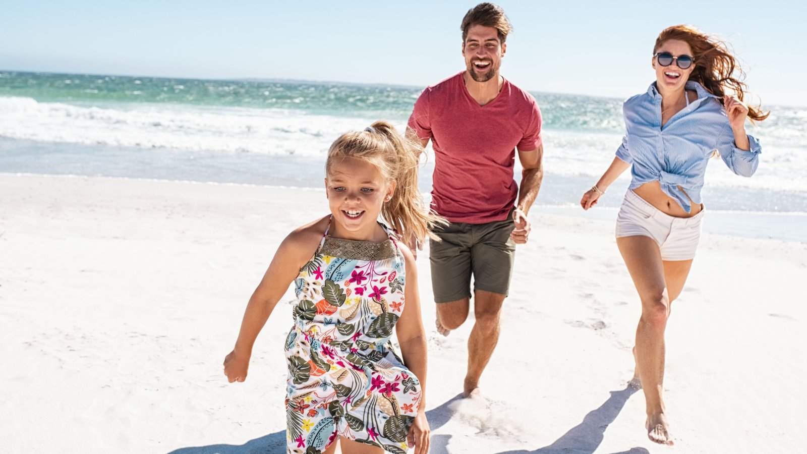 family playing on the beach vacation ground picture shutterstock