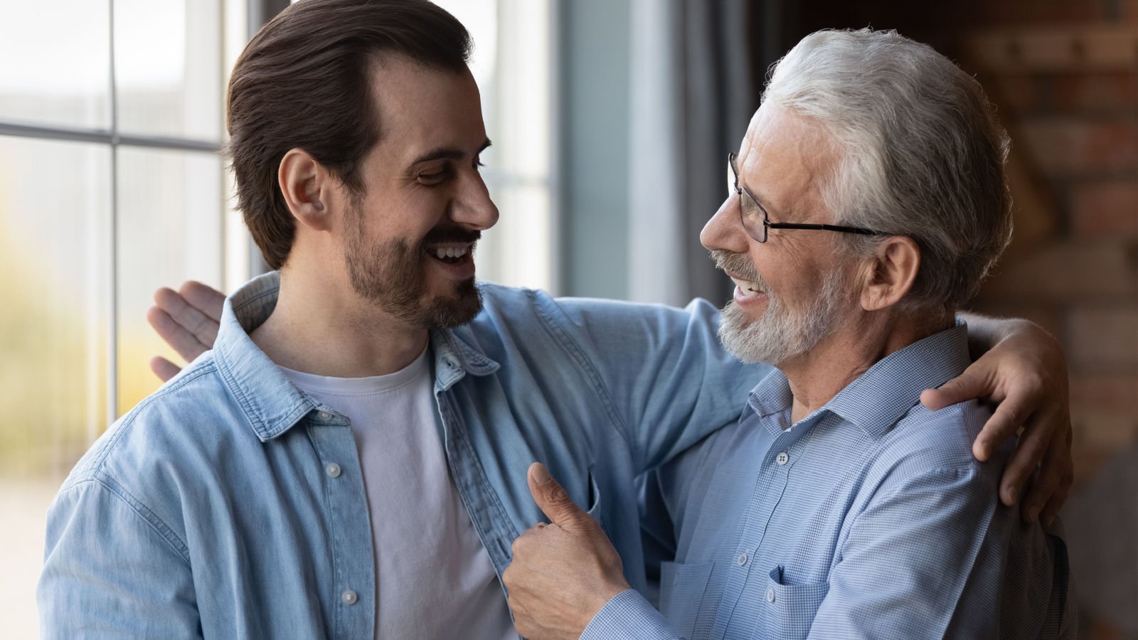 father son good news congratulate with success fizkes shutterstock