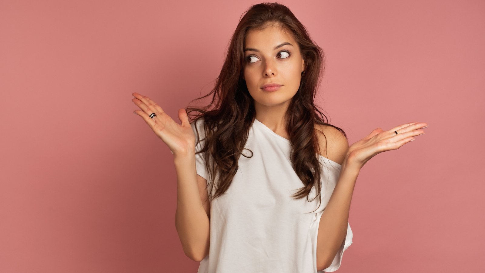 girl in a white top confused huh hands out artem bestsenny shutterstock