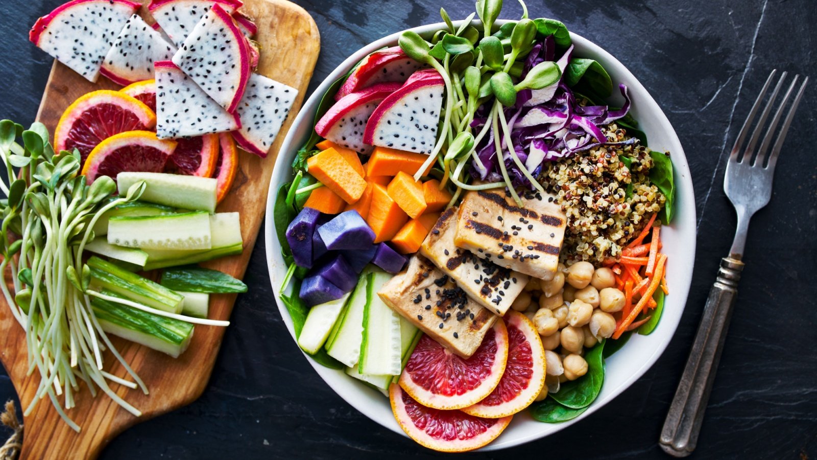 grilled tofu and dragon fruit buddha bowl color blocking cabbage cucumber chickpeas quinoa Joshua Resnick Shutterstock