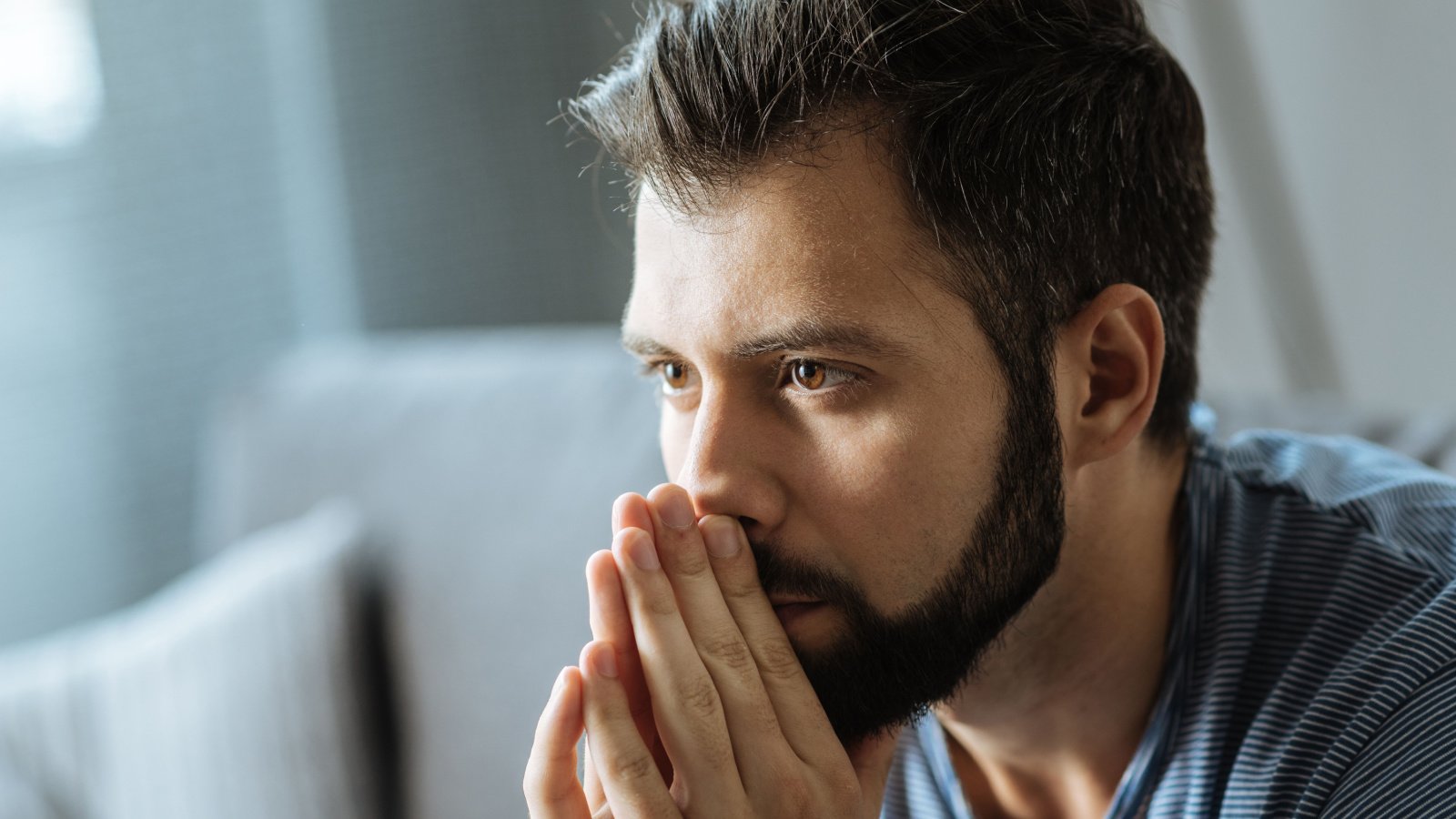 guy hands on face male worried stressed grief guilt sad depressed troubled yakobchuk viacheslav shutterstock