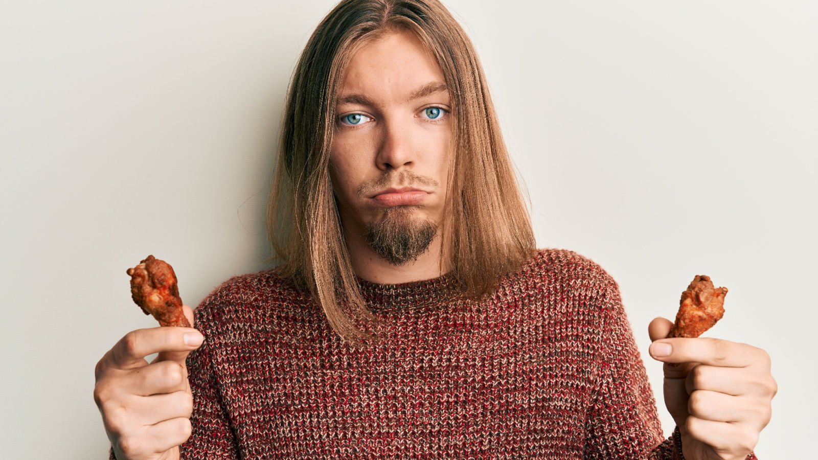 guy with chicken wings kraken images shutterstock