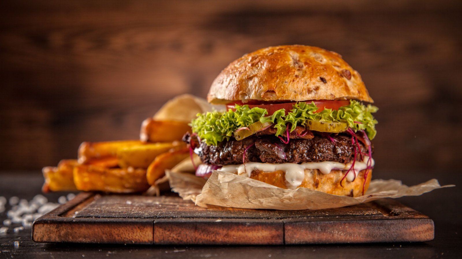 hamburger with lettuce and cheese steak fries pickles tomato bar grill smokehouse Jag cz Shutterstock