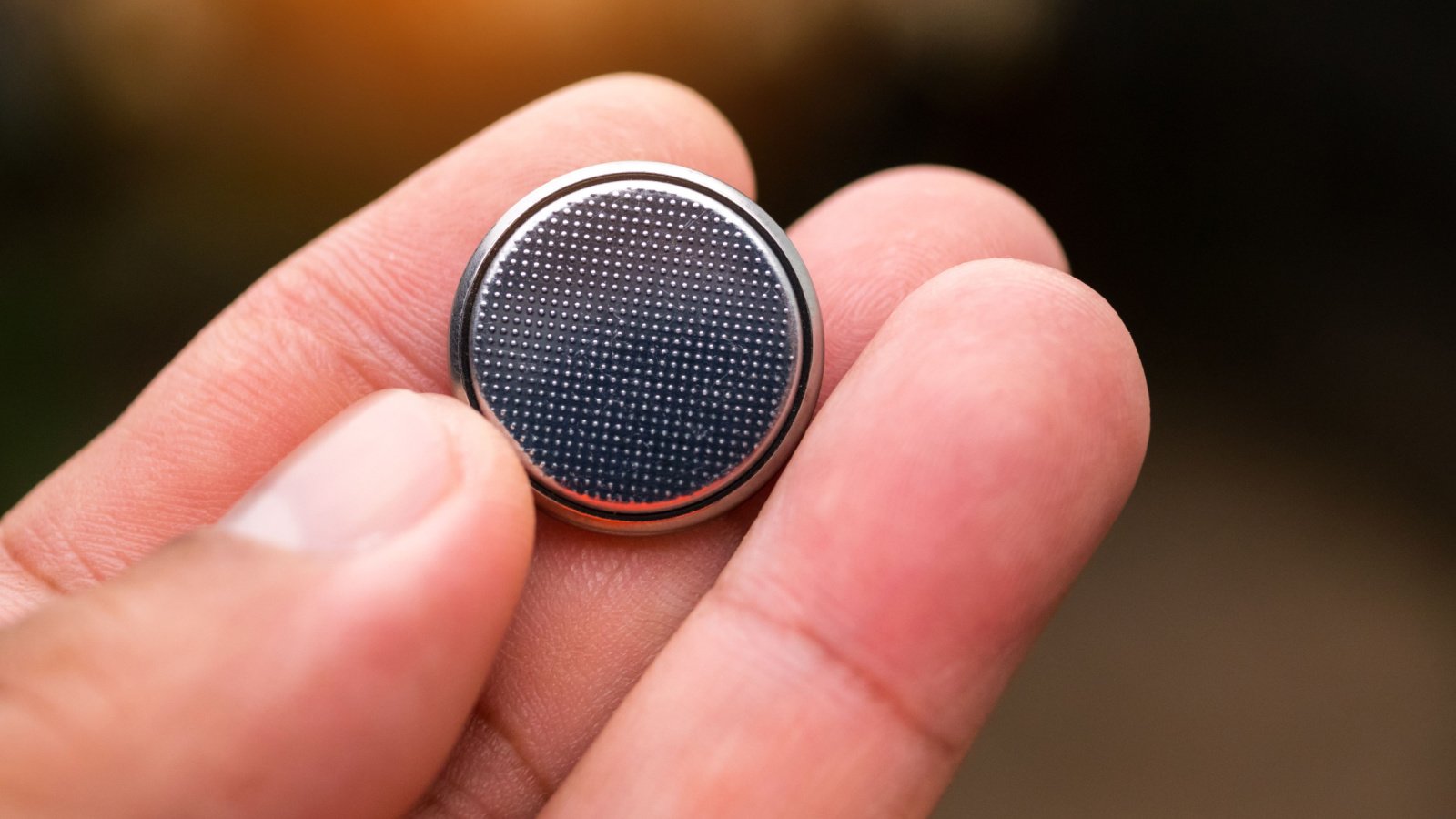 hand button battery Thammanoon Khamchalee shutterstock