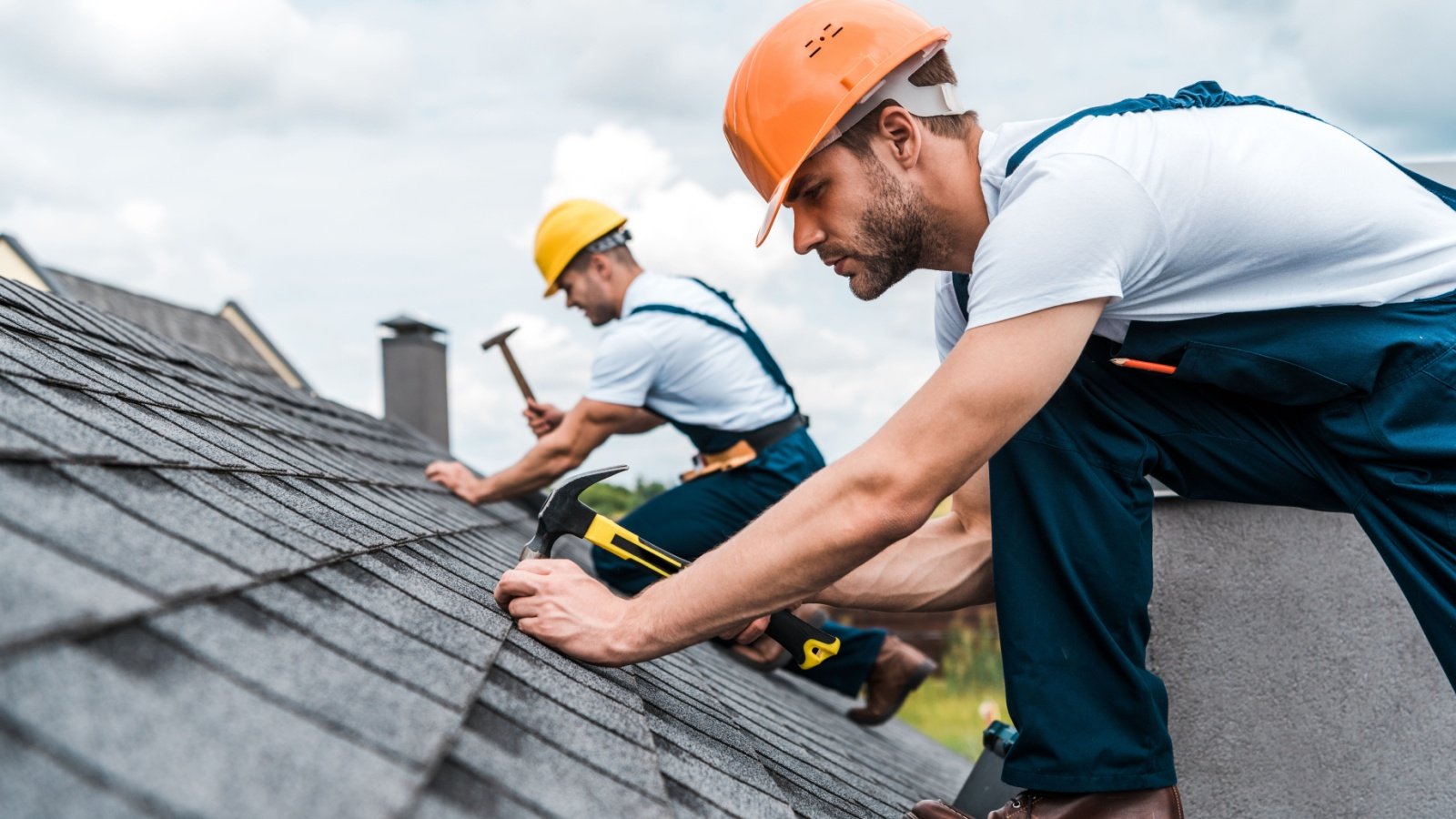 handyman repairing roof LightField Studios Shutterstock