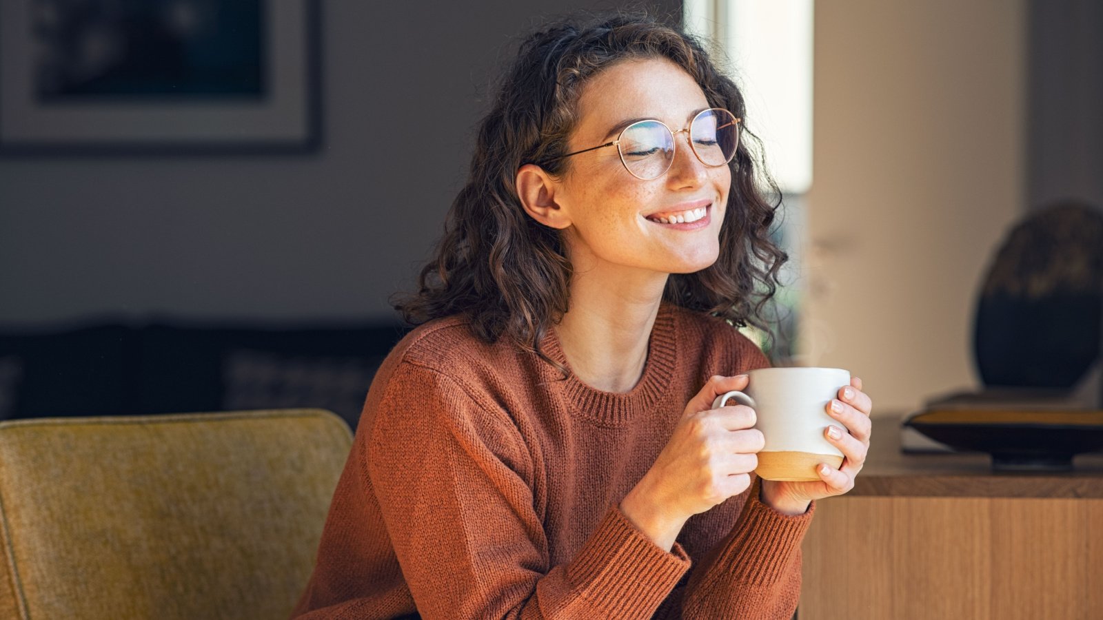 happy young woman home drinking coffee tea cozy ground picture shutterstock