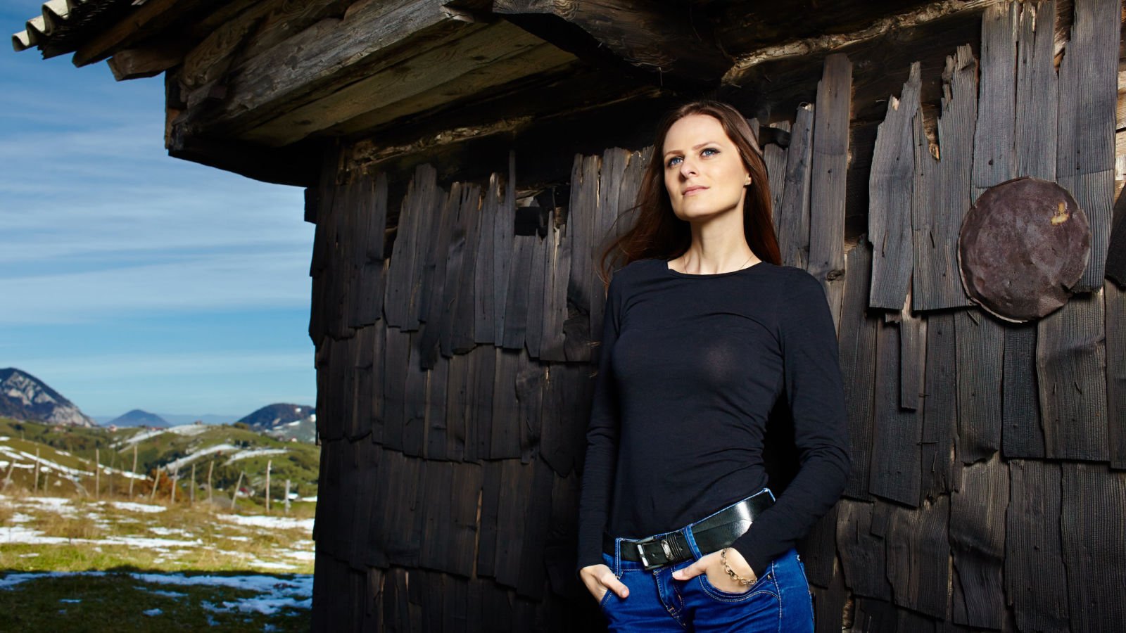 lady at a cabin rental away camping outdoors slatan shutterstock