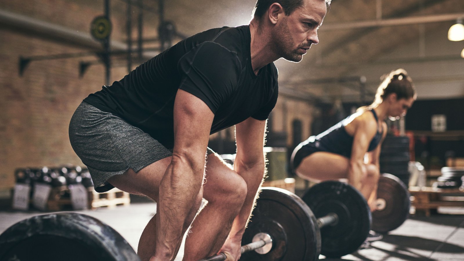 male about to lift barbells in gym workout ground picture shutterstock